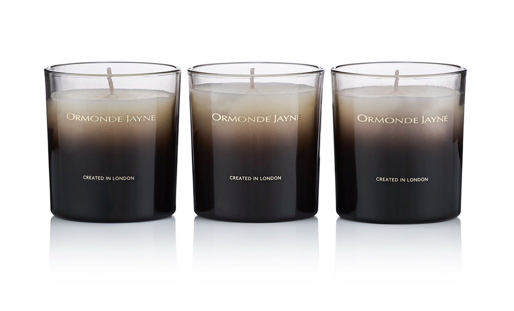 Set of three black to white gradient scented candles in glass holders with Ormonde Jayne branding