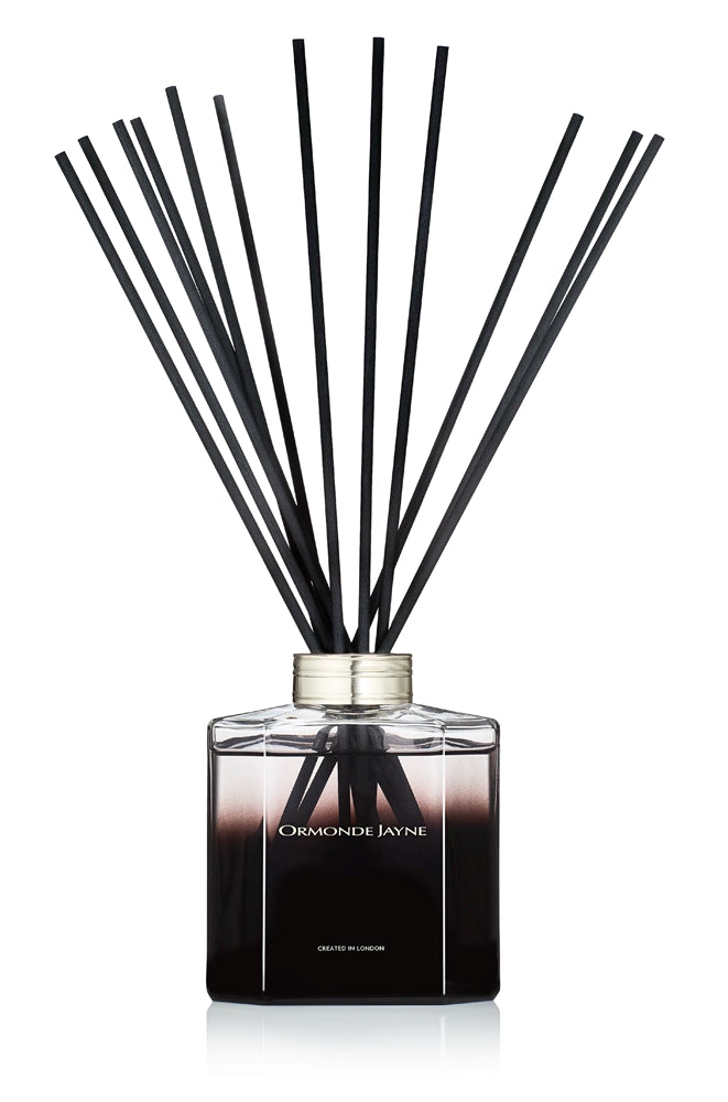 Black gradient glass diffuser bottle with black reed sticks for peony fragrance