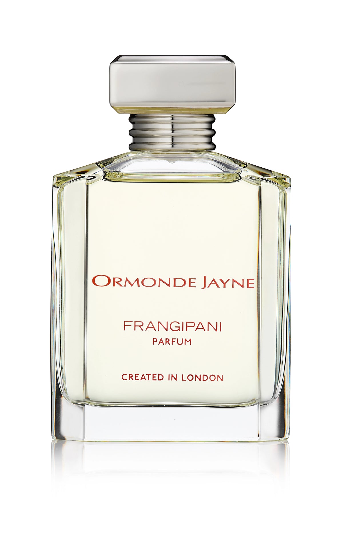 Clear glass perfume bottle with silver cap containing pale yellow Frangipani parfum