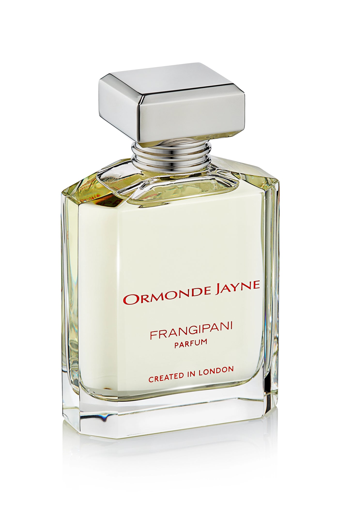 Clear glass perfume bottle with silver cap containing pale yellow Frangipani parfum