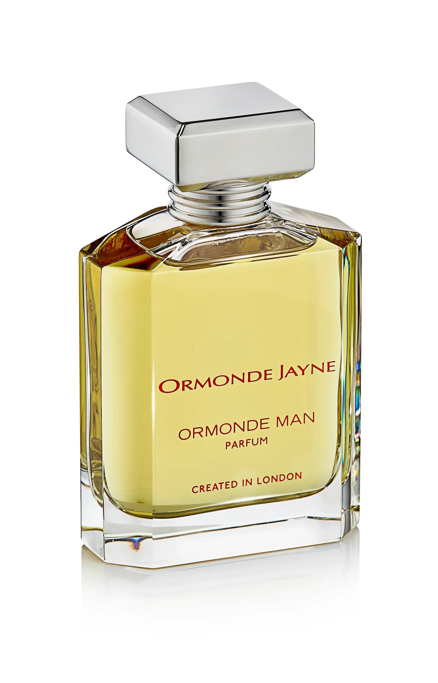Rectangular glass bottle of Ormonde Man parfum with silver cap and amber liquid