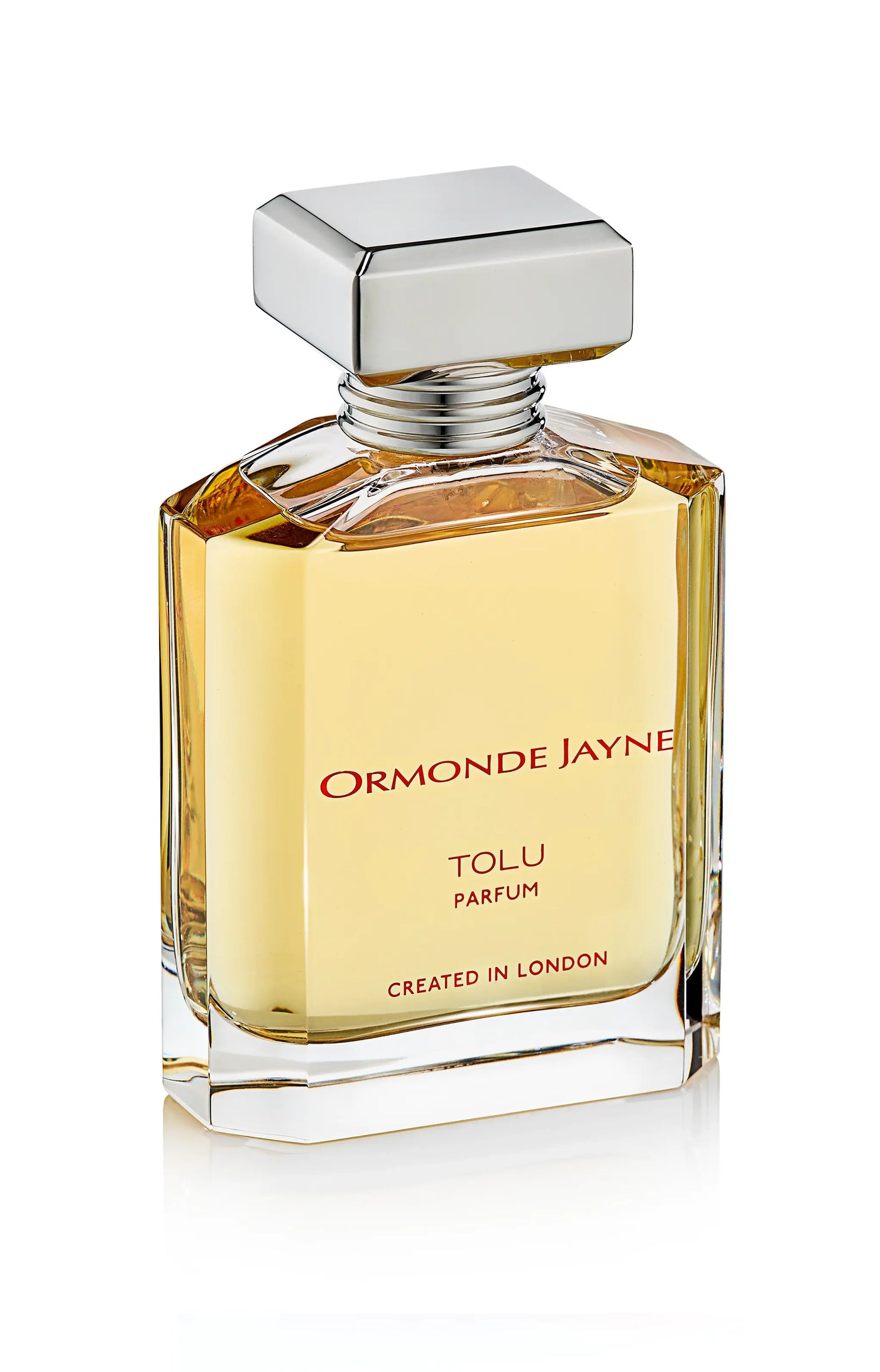 Rectangular glass perfume bottle with golden liquid and silver square cap, labelled Ormonde Jayne Tolu