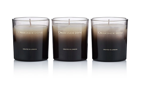 Set of three black to beige gradient scented candles in glass holders with Ormonde Jayne branding