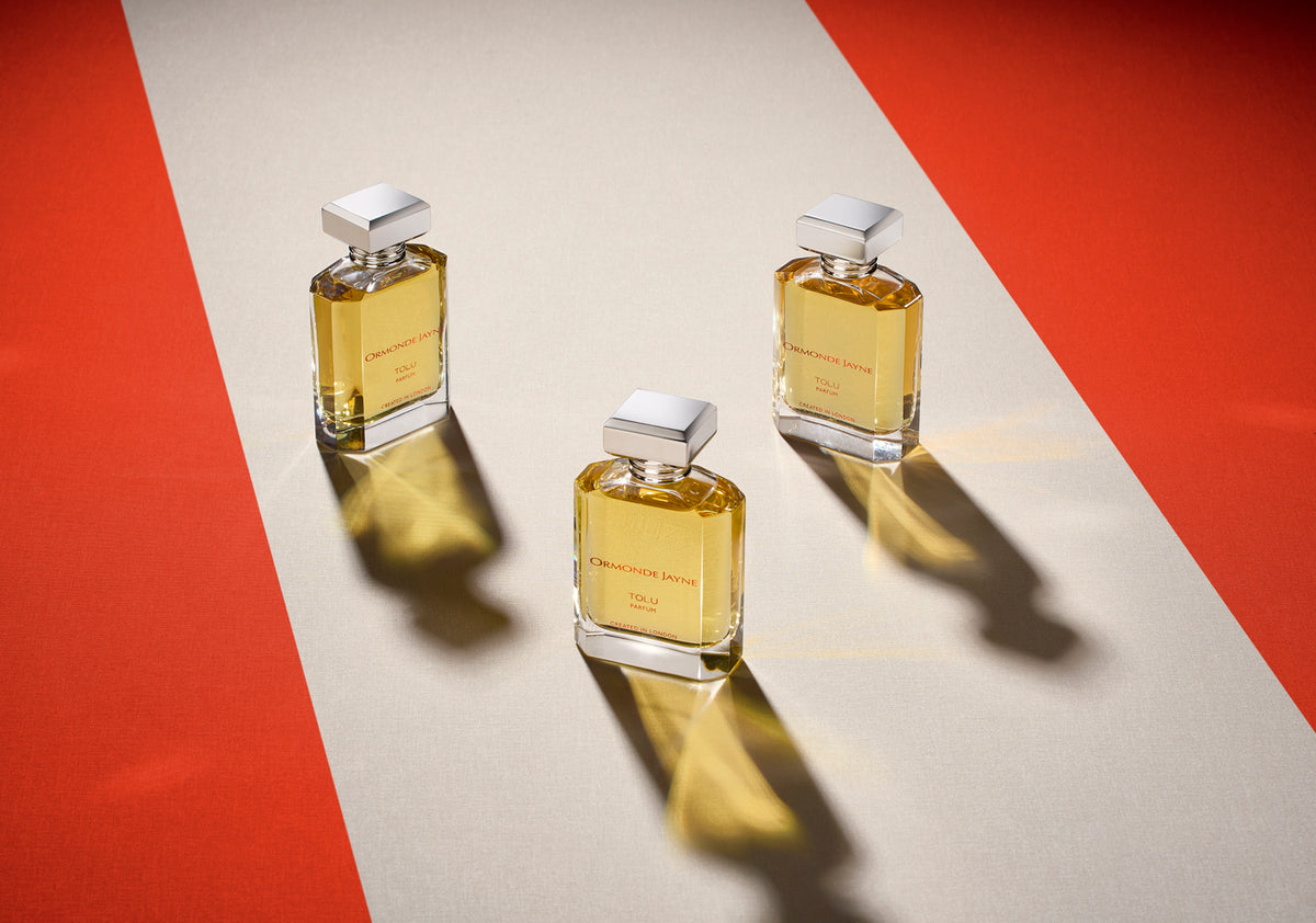 A sculptured flacon of cognac-coloured perfume