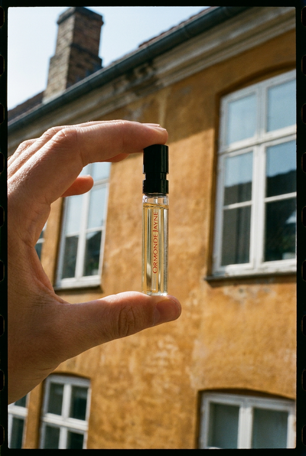 A vial against ochre walls