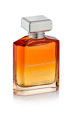 Babylonia eau de parfum in a gradient amber to clear glass bottle with silver square cap