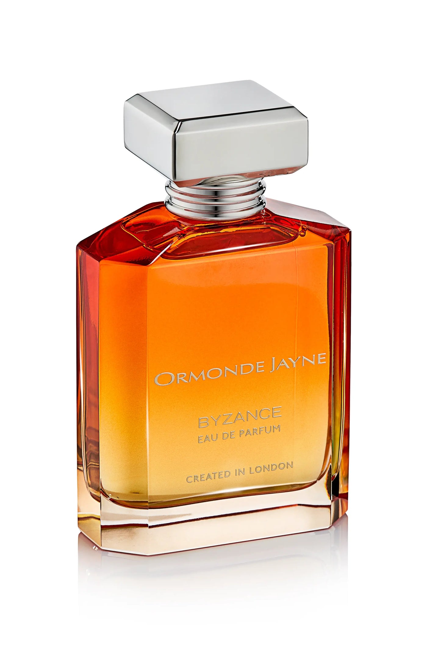 Byzance eau de parfum in a rectangular glass bottle with gradient amber to clear colour and silver cap