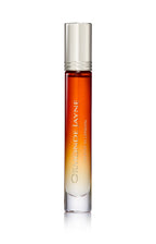 Slim glass perfume bottle with gradient amber to clear colour and silver cap