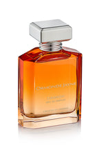 Amber-coloured Damask eau de parfum in a clear rectangular glass bottle with silver cap