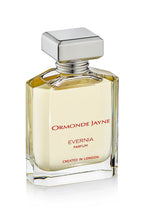 Clear glass perfume bottle with silver cap containing pale yellow Evernia parfum
