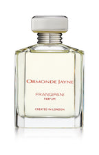 Clear glass perfume bottle with silver cap containing pale yellow Frangipani parfum