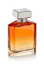 Rectangular glass bottle of Levant eau de parfum with gradient amber to clear colour and silver cap