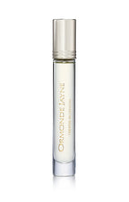Clear glass roll-on perfume bottle with silver cap and gold lettering