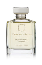 Clear glass perfume bottle with silver cap containing pale yellow Montabaco Intensivo fragrance
