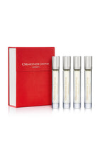 Set of four Montabaco Intensivo perfume vials with silver caps and red presentation box
