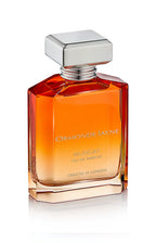 Rectangular glass perfume bottle with orange gradient and silver cap, labelled Muscat by Ormonde Jayne