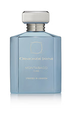 Light blue rectangular Montabaco Cuba perfume bottle with silver cap and gold lettering