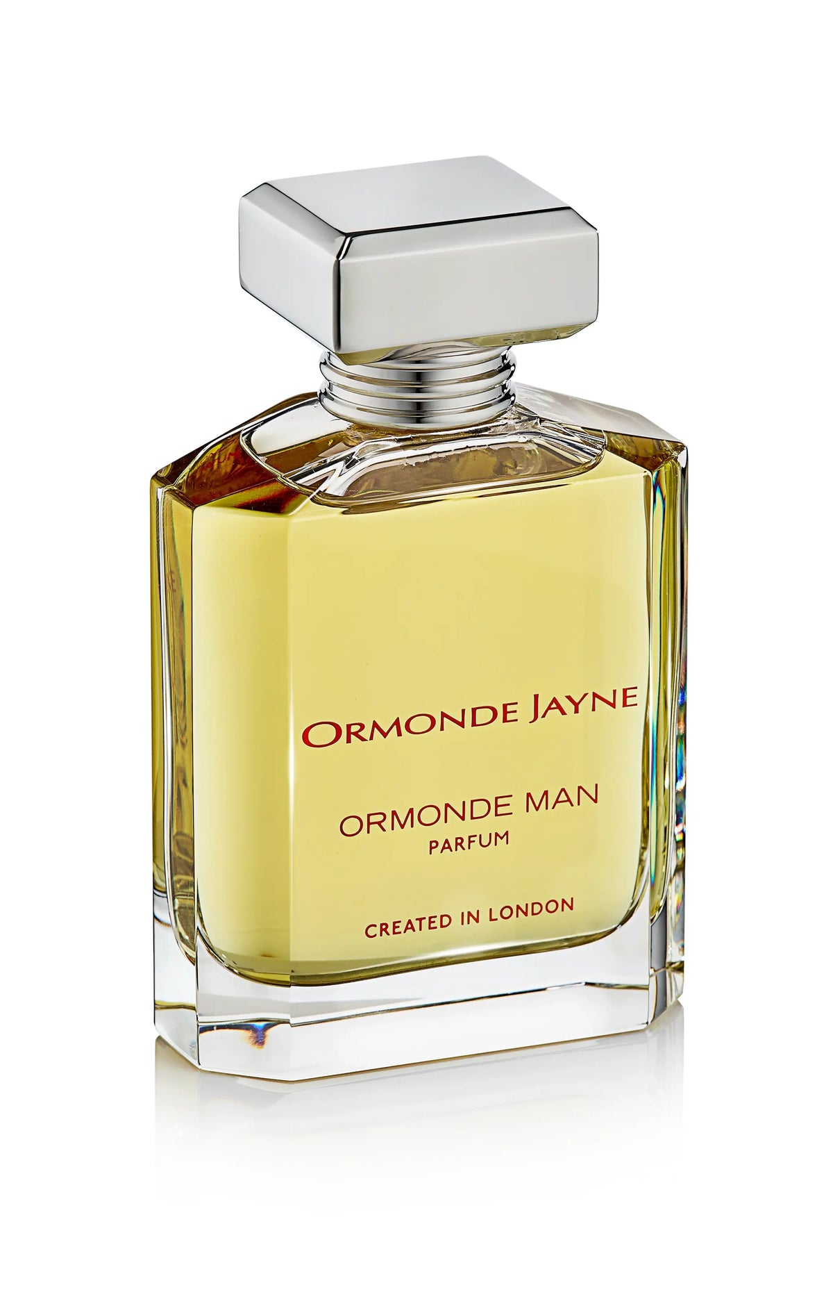 Rectangular glass bottle of Ormonde Man parfum with silver cap and amber liquid