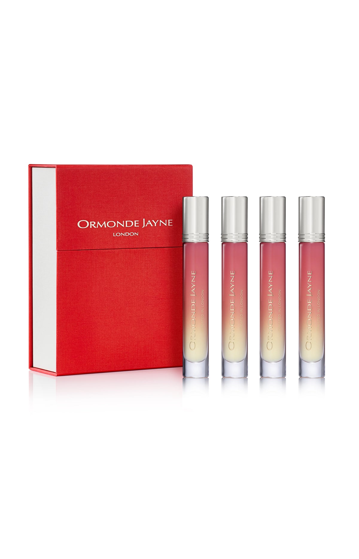 Set of four gradient pink to cream Ormonde Jayne London perfume sprays with silver caps and red box