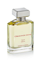 Clear glass perfume bottle with silver cap containing pale yellow Ta'if parfum