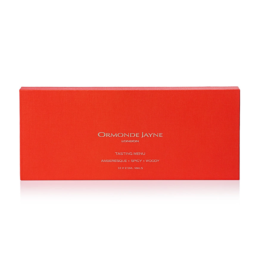 Rectangular red box with white text, containing Amberesque woody and spicy tasting menu