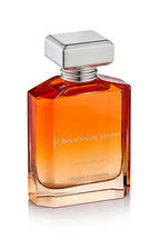 Rectangular glass perfume bottle with gradient amber to clear colour and silver cap