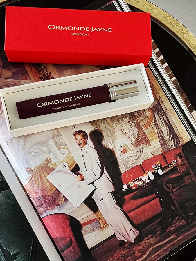 The coral travel case on a tray